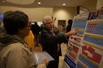 Librarian Silas Marques Olivera explains his research to an attendee