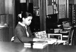 [A student worker in the James White Library] by James White Library