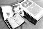[A volume of the Bomberg Bible, a handwritten hymn book, and a copy of Pope Leo X's bull against Martin Luther in the Andrews University Heritage Room] by James White Library