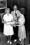 [Mr. and Mrs. Henry C. Harmeling donate two old family Bibles to the Andrews University Heritage Room] by James White Library